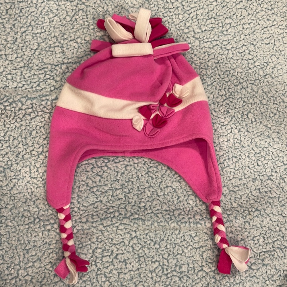 Adorable obermeyer like new winter hat!Pink red and white hat with ear coverage.